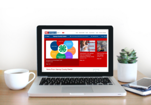 Laptop Screen open to New Extension Website Homepage